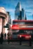 London Bank long exposer. Woman waiting for the bus to pass by in front of the London CIty