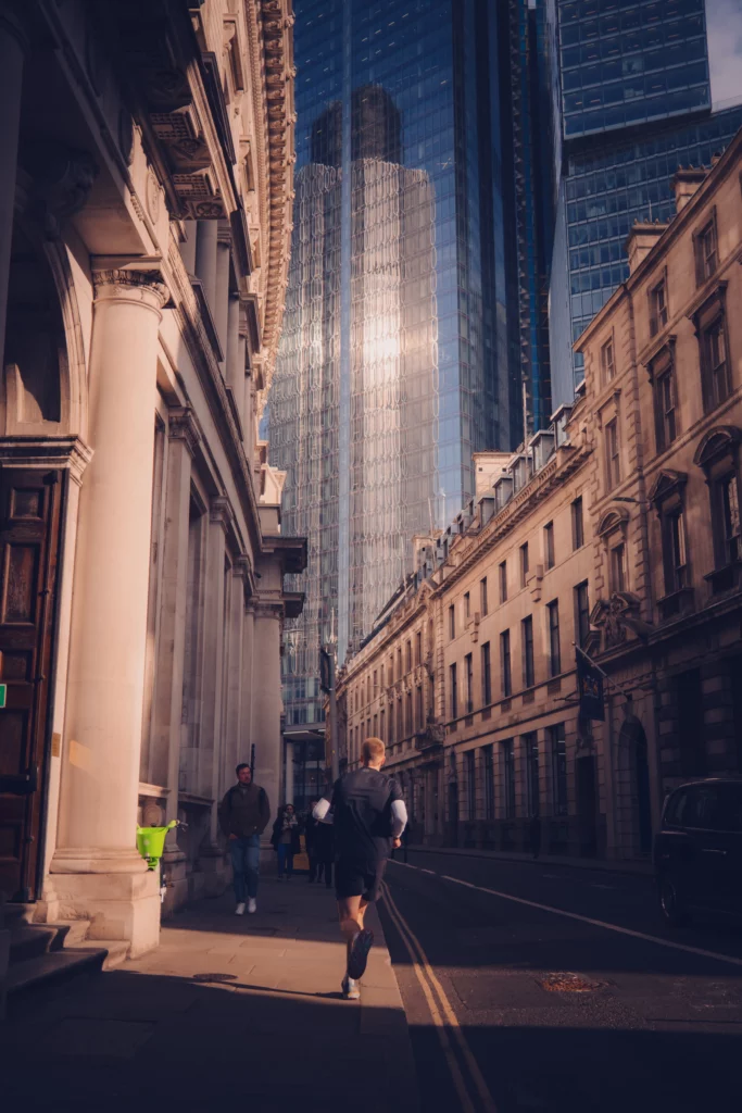 Photo of a man running in London City. Fujifilm X100vi