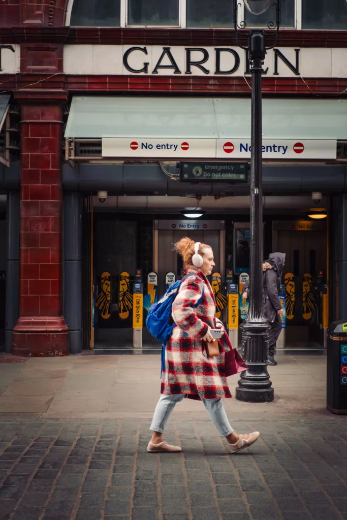 fujifilm-xt30-24-shots-street-photography-london-07 Woman with earphone in front of Covent Garden tube station. Fujifilm X-T30 24 shots only.