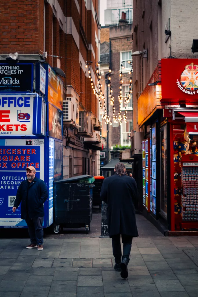 fujifilm-xt30-24-shots-street-photography-london-22 Man walking into an alley in London West End theatre district. Fujifilm X-T30 street photography like an old film camera.